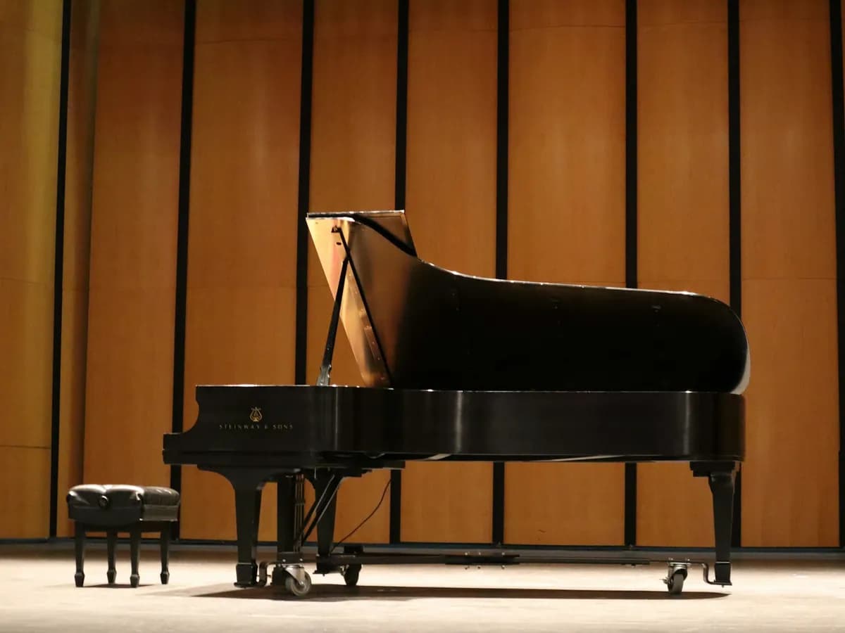 Black grand piano on a stage